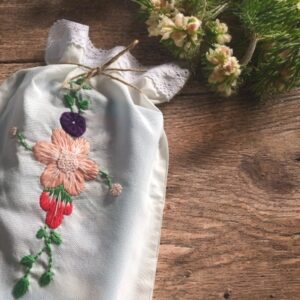 Drawstring Book Bag with Hand-Embroidered Floral Design